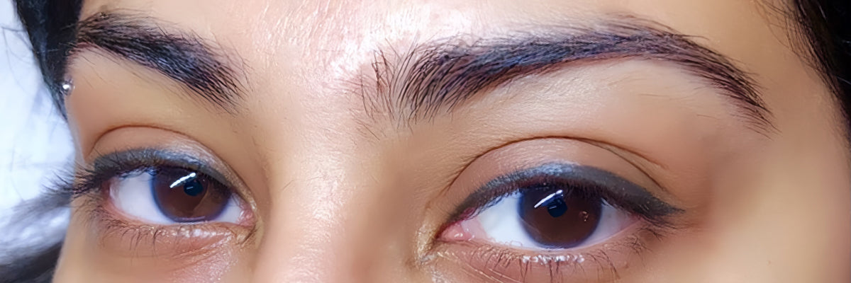 Close-up of winged eyeliner tattoo results on a client after a permanent makeup procedure.