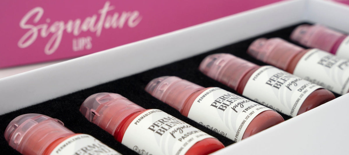 Perma Blend Signature Lip pigment collection displayed in an open box with seven bottles inside